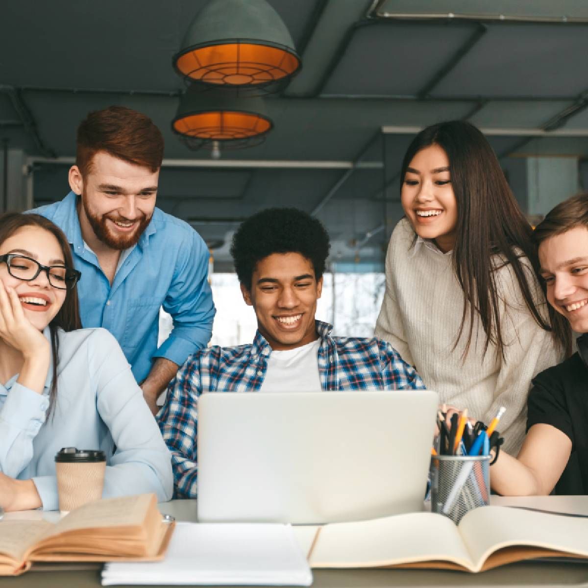 Five diverse teens centered around a school-issued laptop
